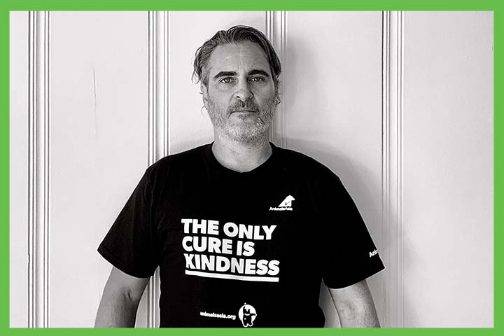 Joaquin Phoenix wearing a t-shirt bearing the words “The Only Cure is Kindness”